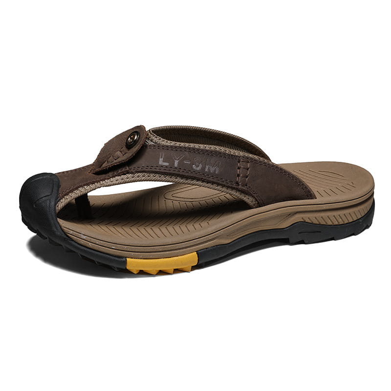 men’s brown leather beach sandals outdoor sport flip flops with black rubber toe cap and yellow accent on the sole.