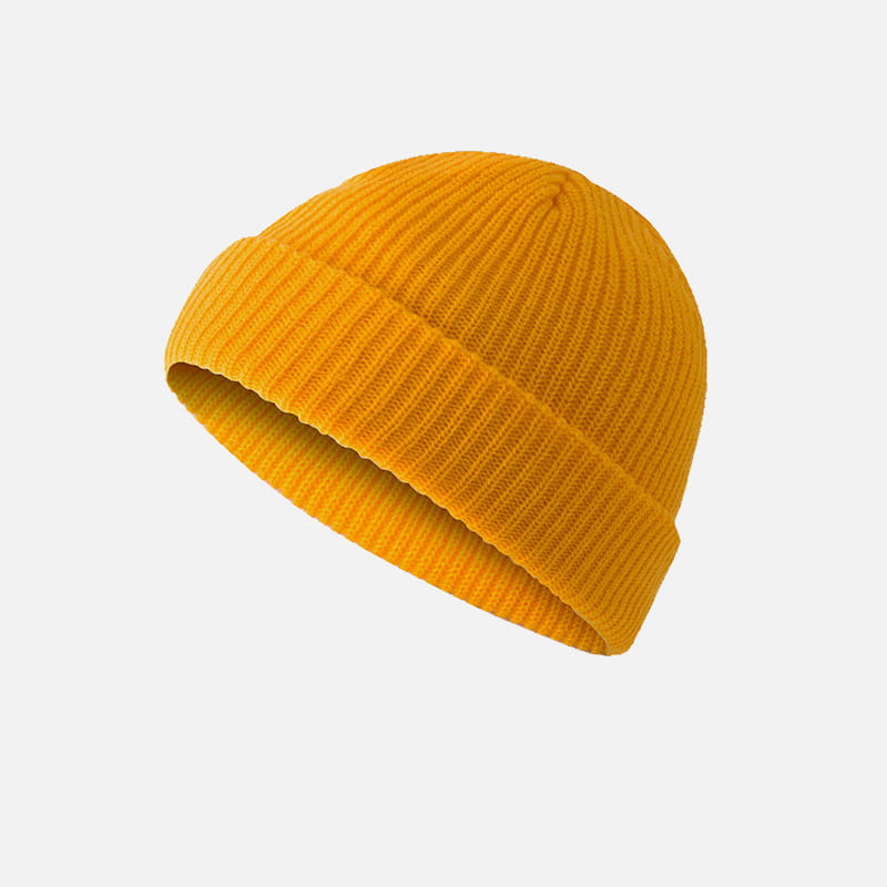 a mustard-yellow ribbed knit beanie with a folded cuff shown as an alternative to the dark gray ribbed wool beanie hat product