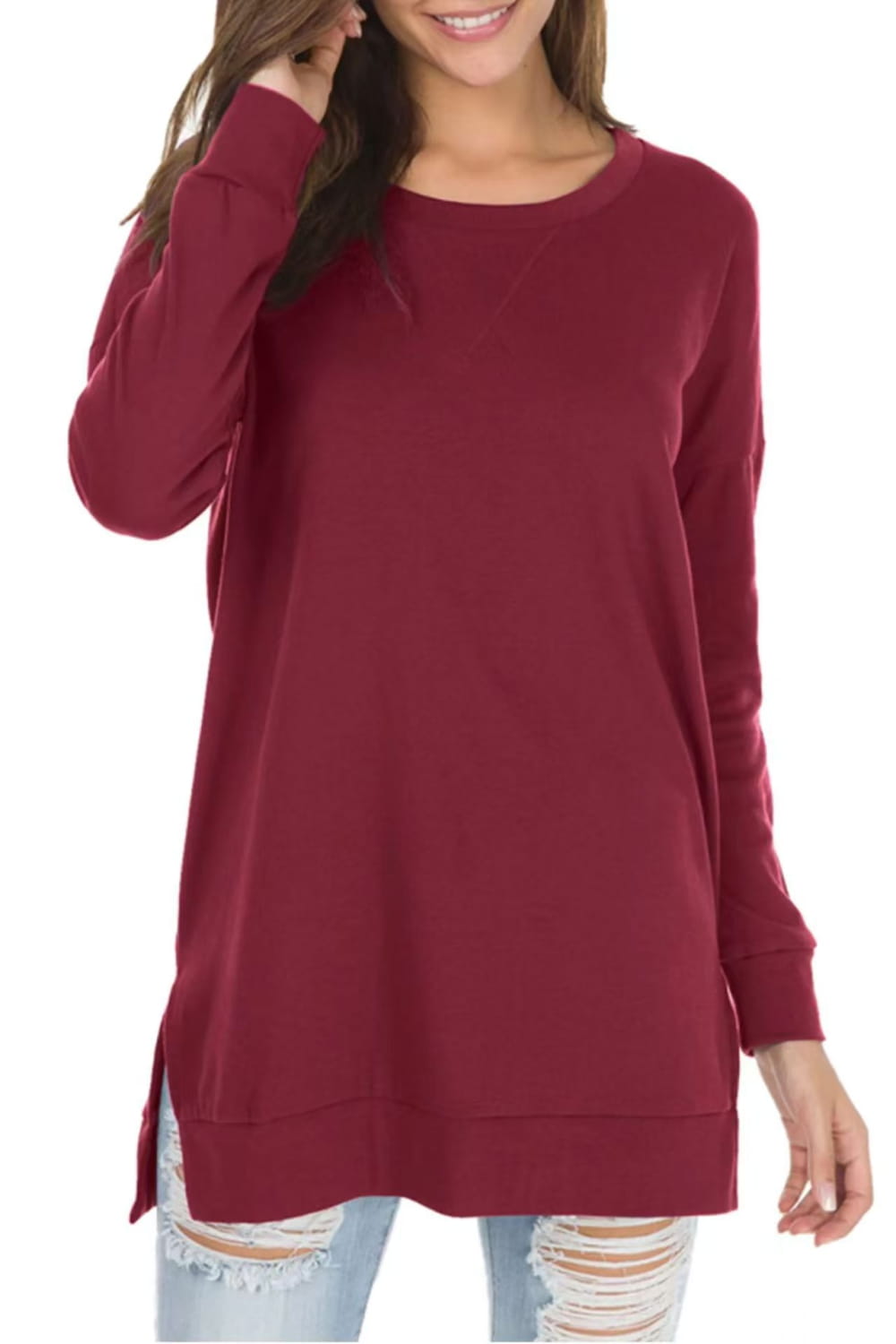 A soft maroon long-sleeved split front relaxed knit sweater with side slits.