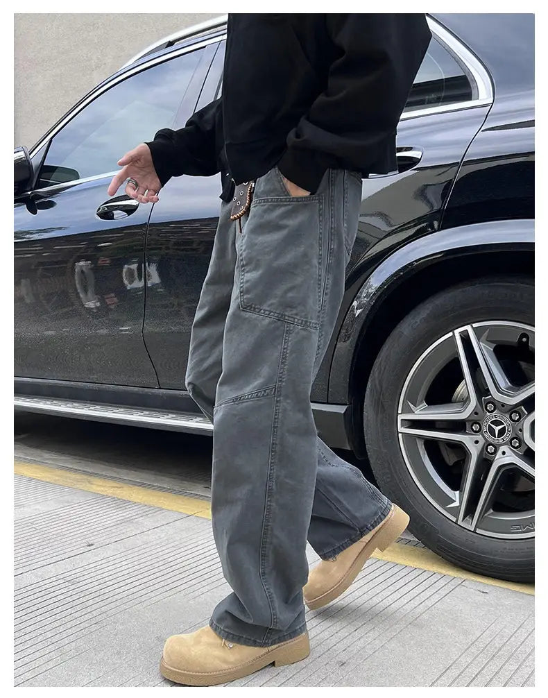 olive green cargo pants mens cotton workwear featuring grey denim jeans with a relaxed straight-leg cut and visible stitching details.
