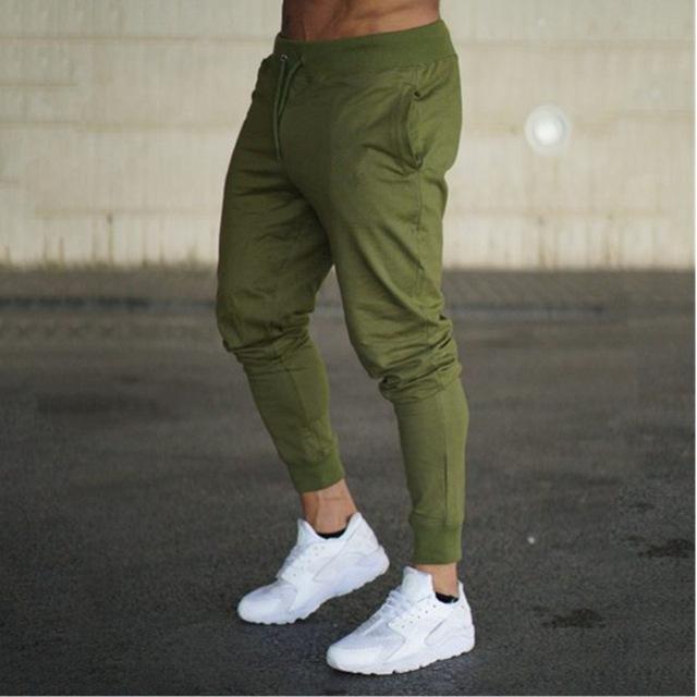 olive green men’s casual slim fit jogger pants with elastic cuffs and side pockets designed for comfort and daily wear