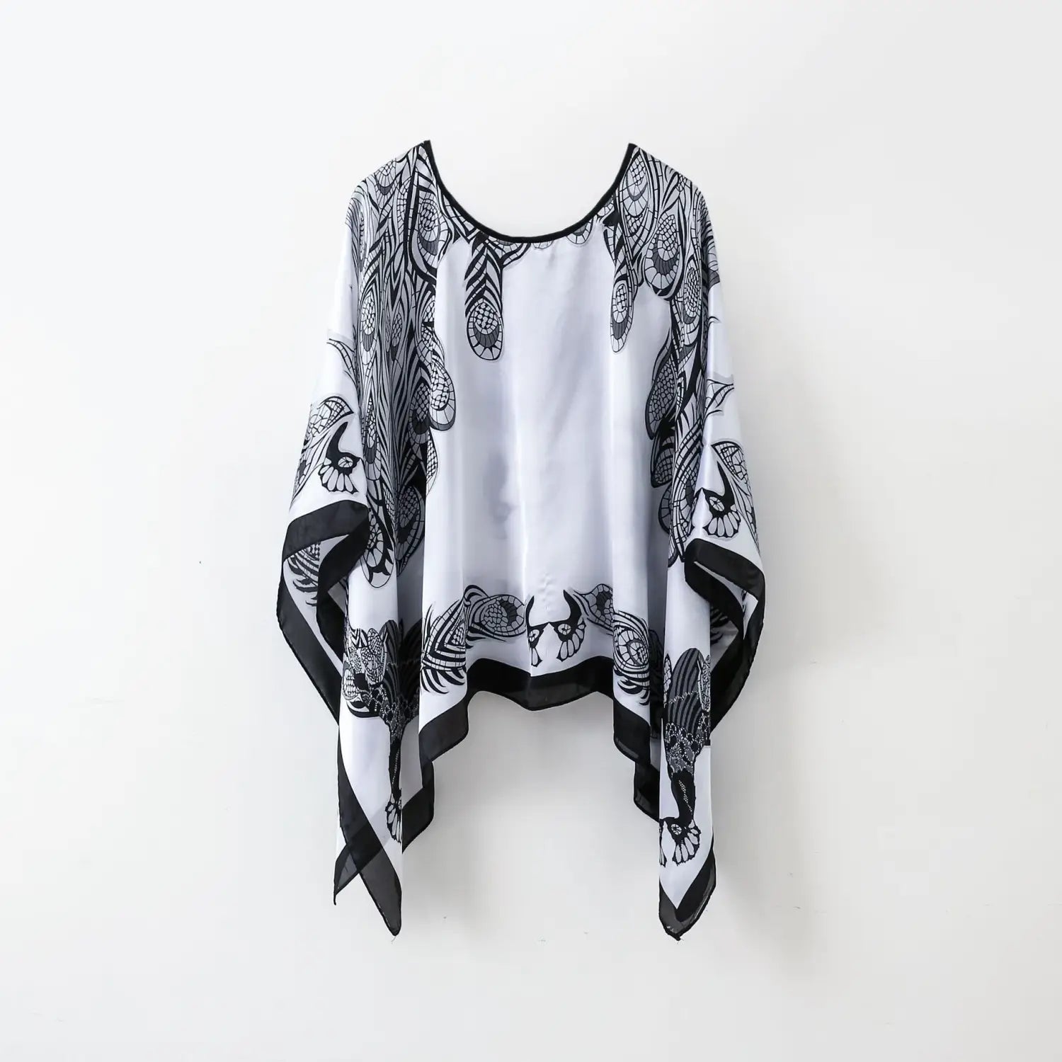white chiffon printed silk patterned pullover shawl cape outerwear with black intricate feather and bird patterns and solid black trim