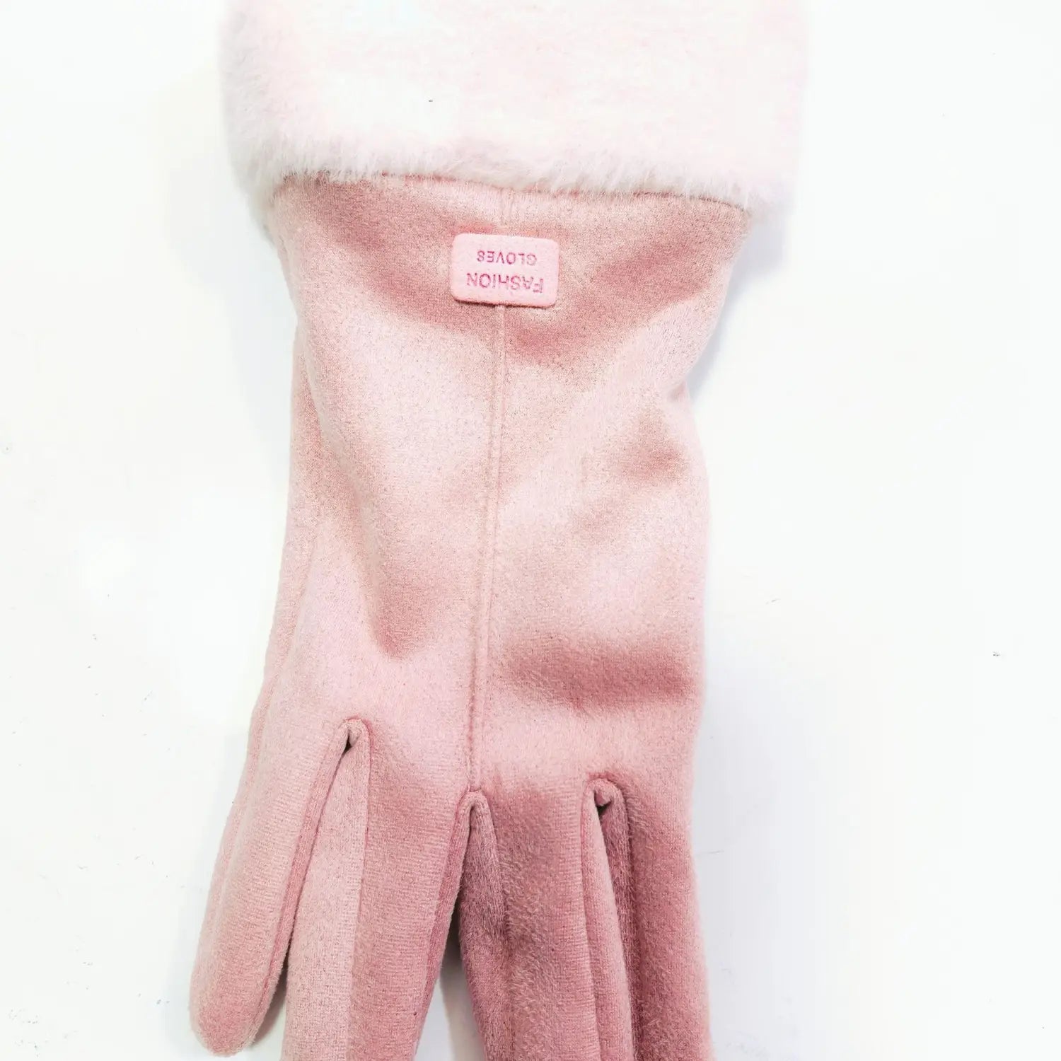 A soft pink thermal suede touchscreen glove with a fluffy white cuff and a small fashion gloves label visible on the back side.