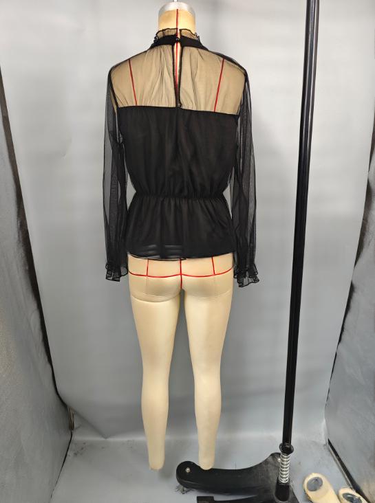 black sheer ruffled peplum blouse with long sleeves and fitted waist shown from the back featuring red seam accents along the sheer fabric.