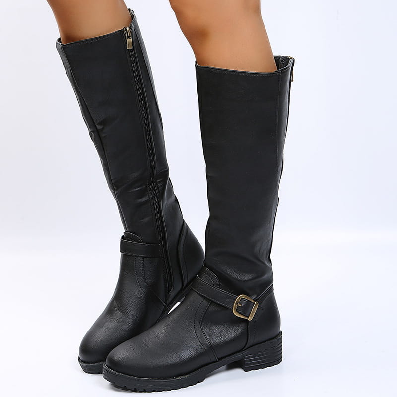 Leather knee high knight boots with buckle strap featuring a matte black leather finish and gold-toned buckles and inner side zippers.