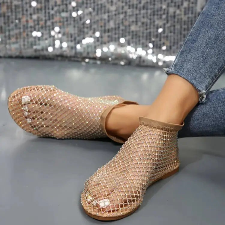 Glittering gold mesh ankle boots for women with a flat sole and decorative rhinestones.