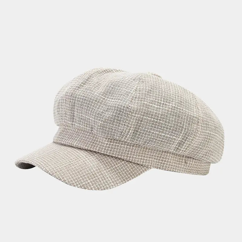 Beige textured tweed flat cap with a structured eight-panel design and short brim from the British style tweed octagonal cap women collection.