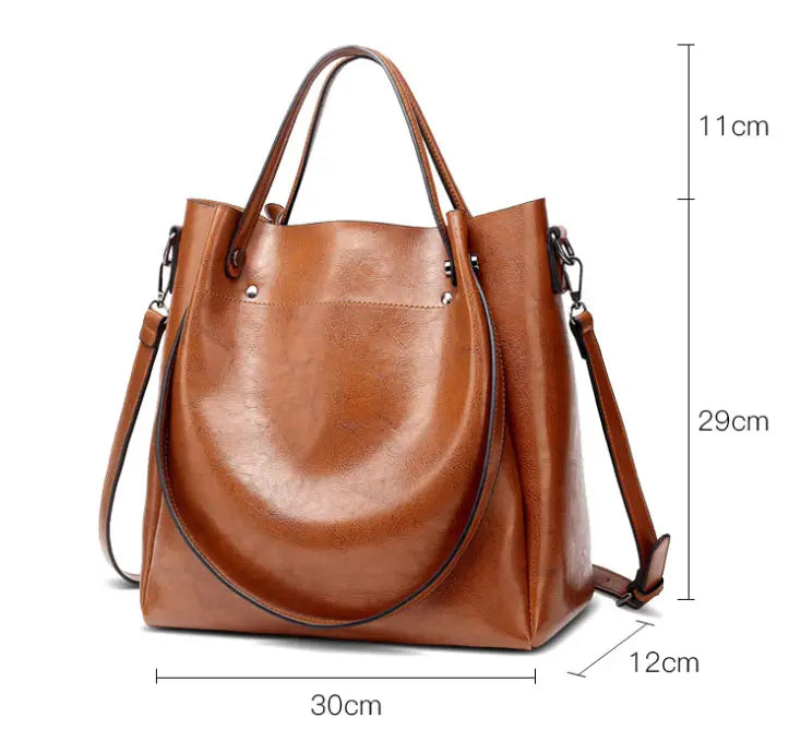 Brown leather large capacity faux leather tote shoulder bag with top handles and detachable shoulder strap.