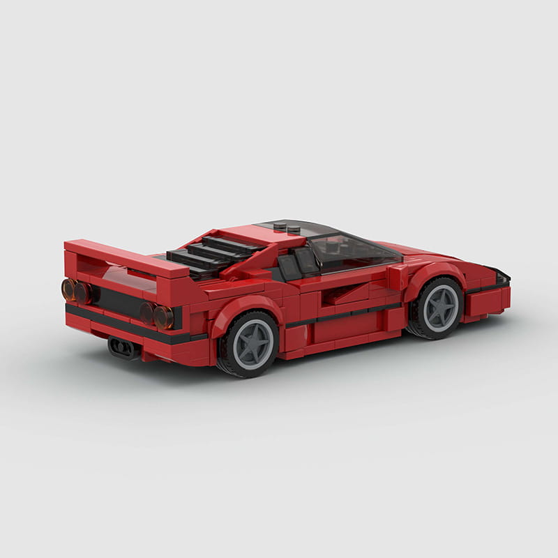Modelo de coche deportivo de juguete de bloques tipo construcción, Ferrari F40 Lego rojo, con acentos negros y ruedas grises.