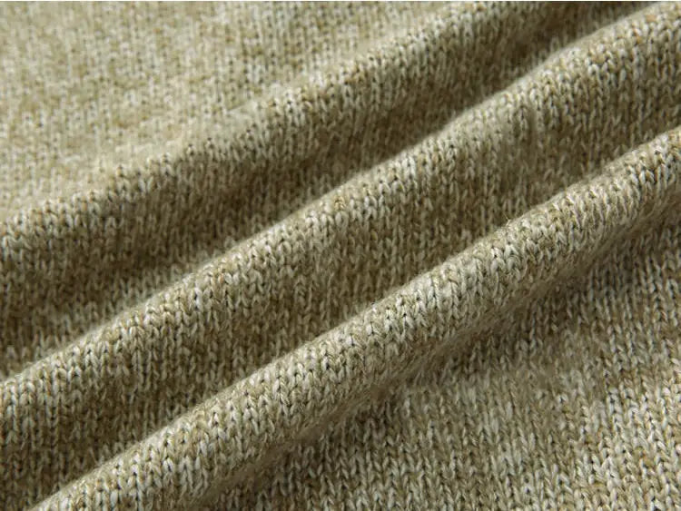 Men’s double-breasted knit cardigan featuring beige and cream heathered fabric with a textured ribbed pattern.