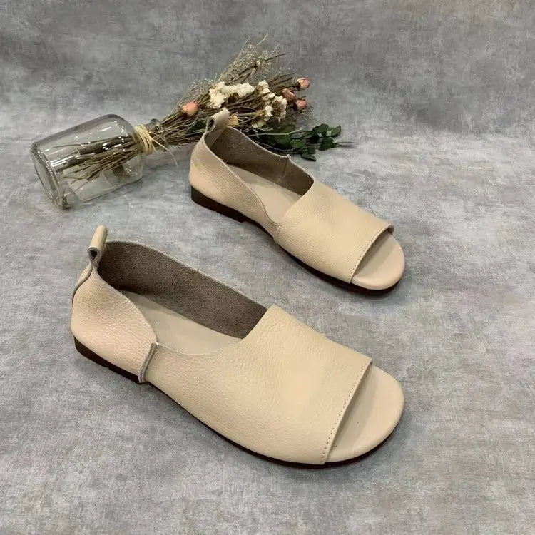 Beige leather sandals retro soft sole peep toe slip ons featuring a minimalist design and low-profile sole.