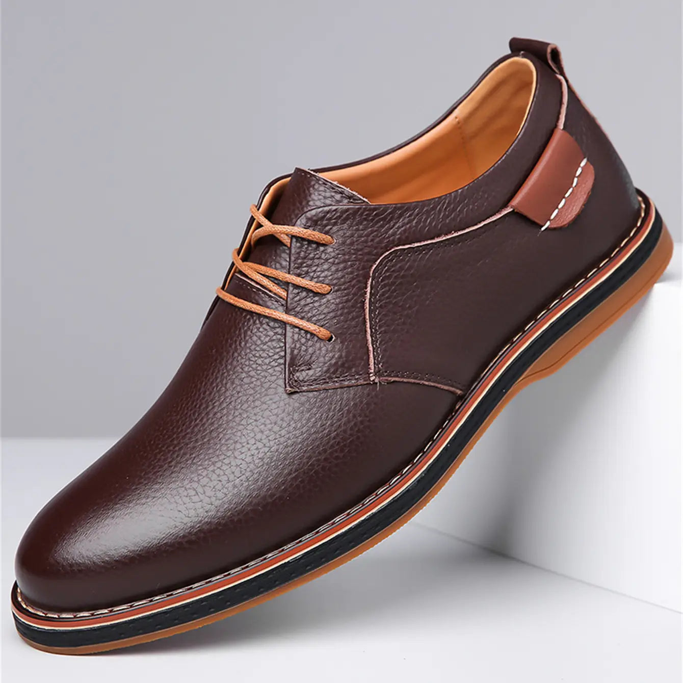men’s handmade genuine leather lace up oxford shoe in brown leather with tan laces and a contrasting black and brown sole.
