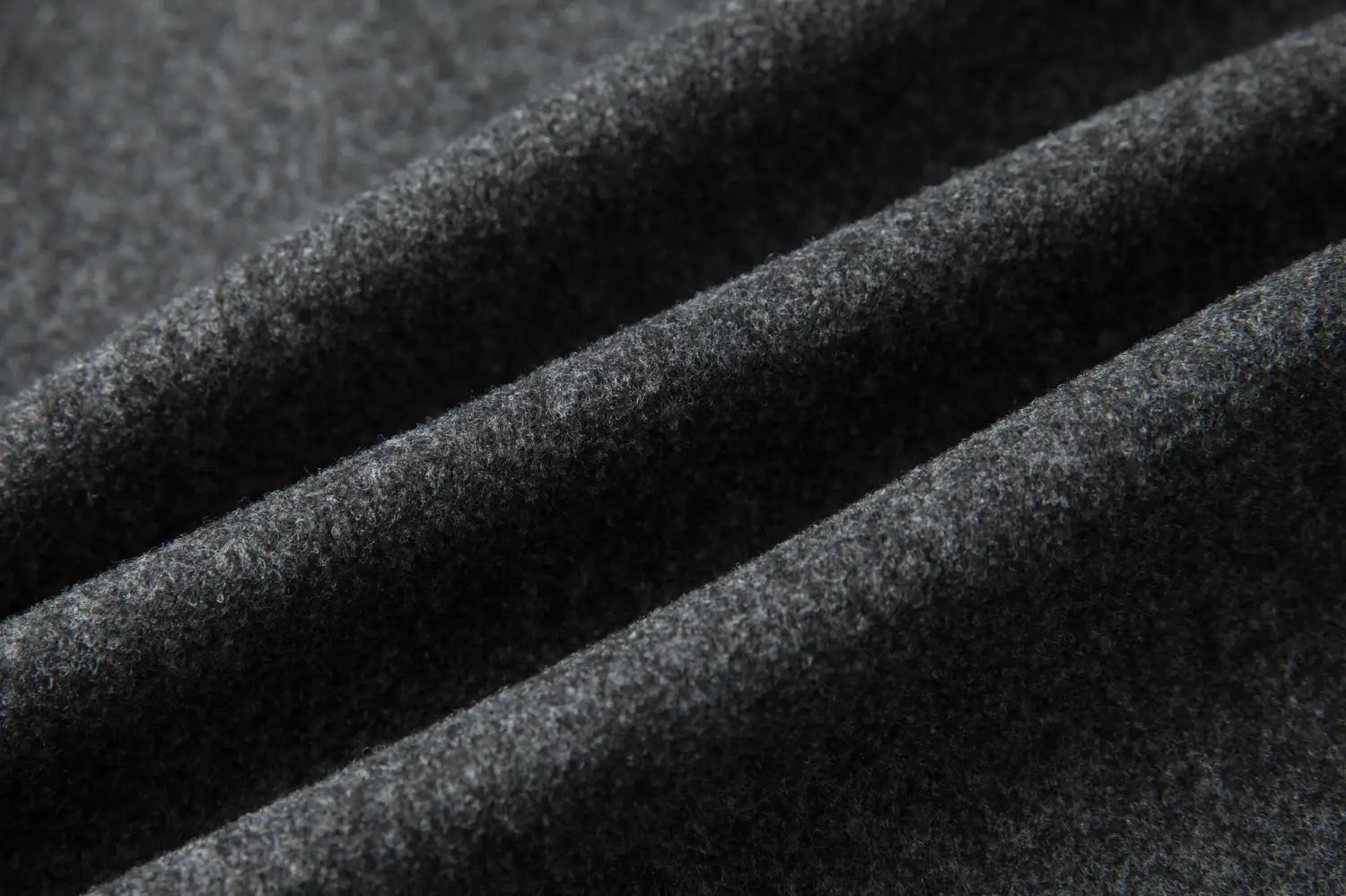 Men double breasted wool overcoat mid length coat in dark gray woolen fabric with a soft textured surface.