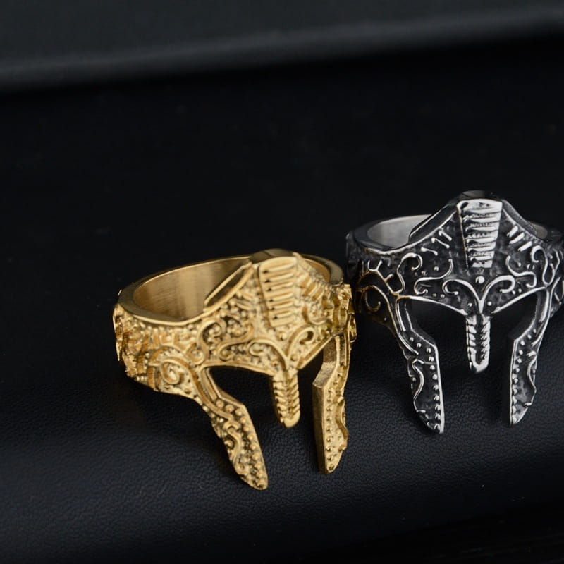 Gold and silver spartan warrior helmet engraved stainless steel rings with intricate detailed designs.