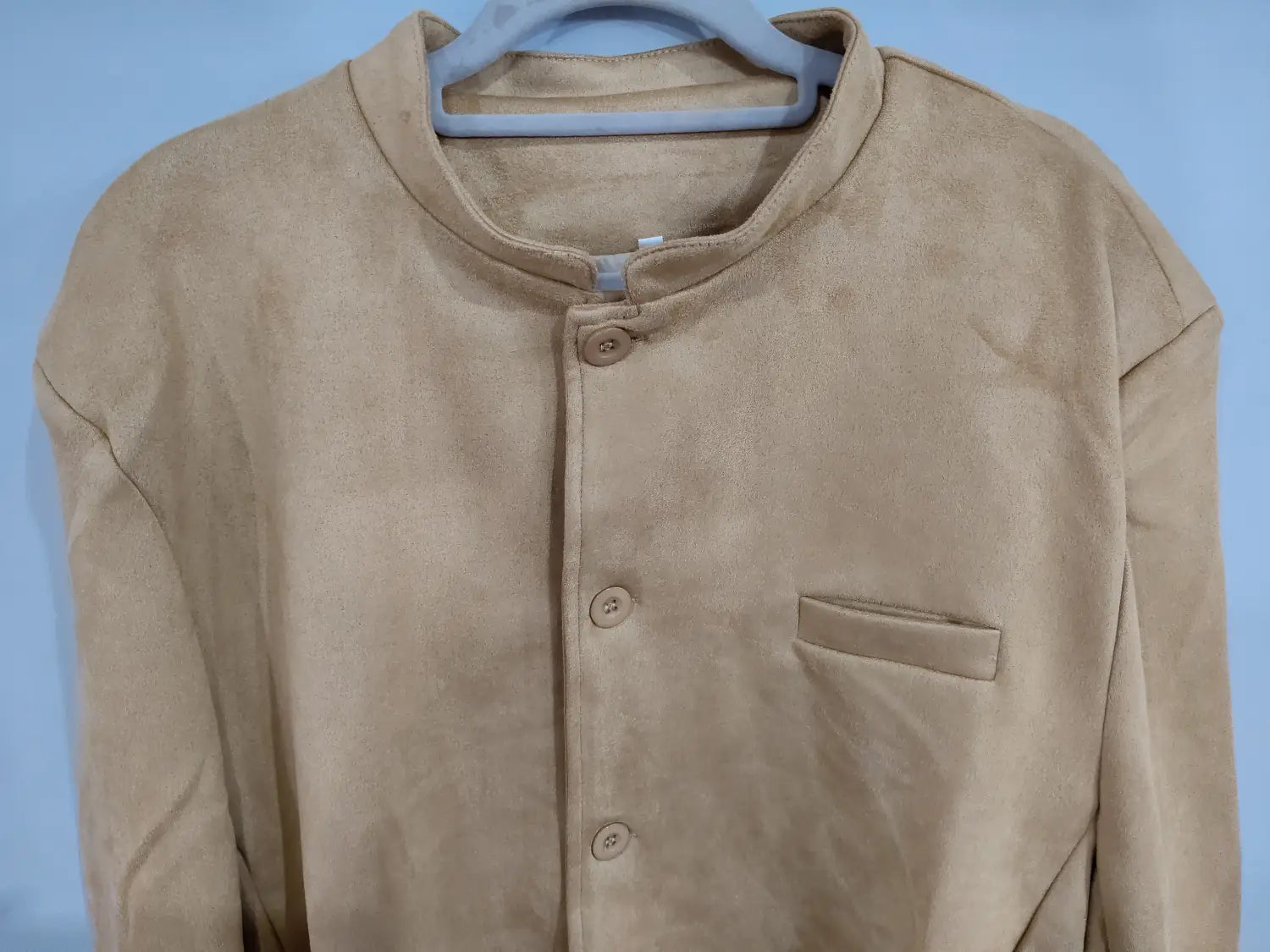 Men’s brown suede business casual blazer jacket in beige featuring a mandarin collar and three matching buttons.