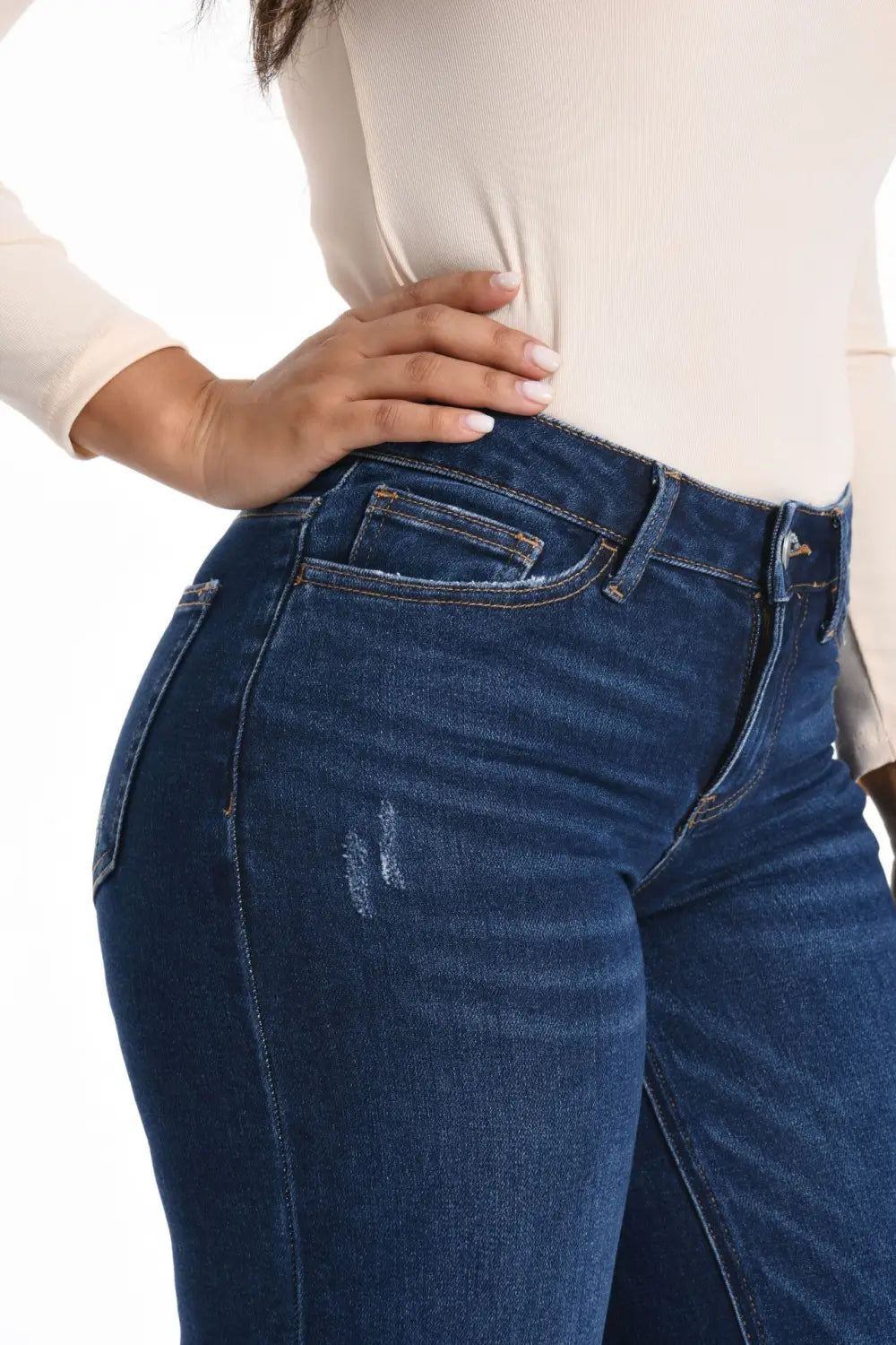 Dark blue wide leg stretch denim jeans with a fitted high-rise cut and subtle distressing on the thigh.