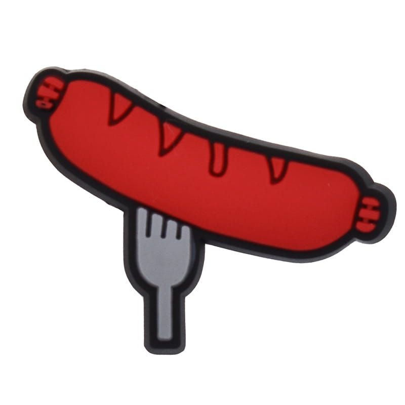 Food themed shoe charm shaped like a red sausage with a black outline and gray fork detail designed for sandals and clogs.