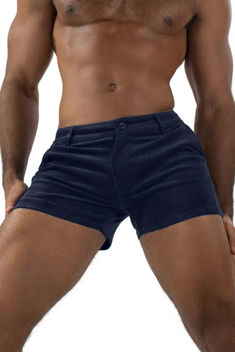 Navy blue men corduroy beach shorts with a classic button and flap closure designed for casual mid rise wear.