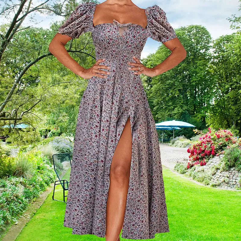 A flowing lavender floral midi dress featuring puffed short sleeves, a square neckline, and a slit, ideal for elegant occasions.