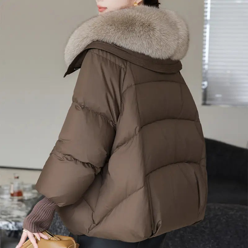 Brown women short down puffer jacket with a plush light gray fur-lined hood designed for warmth and style.