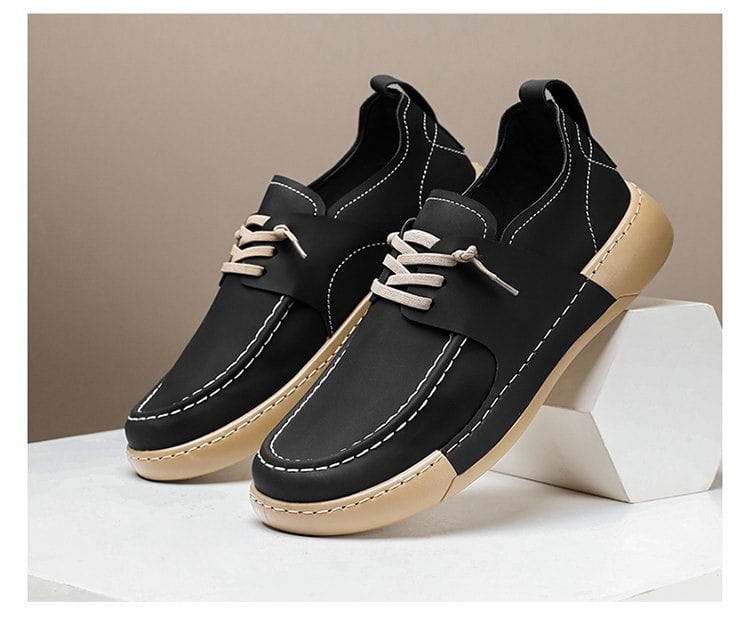 Chaussures à lacets rétro britanniques élégance décontractée pour homme en cuir noir, semelles beiges et couture blanche.