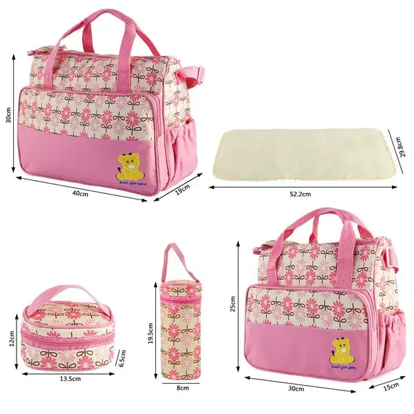 pink floral-patterned baby diaper travel bag with yellow bear appliqué on front in 5 piece bear appliqué baby diaper travel bag set