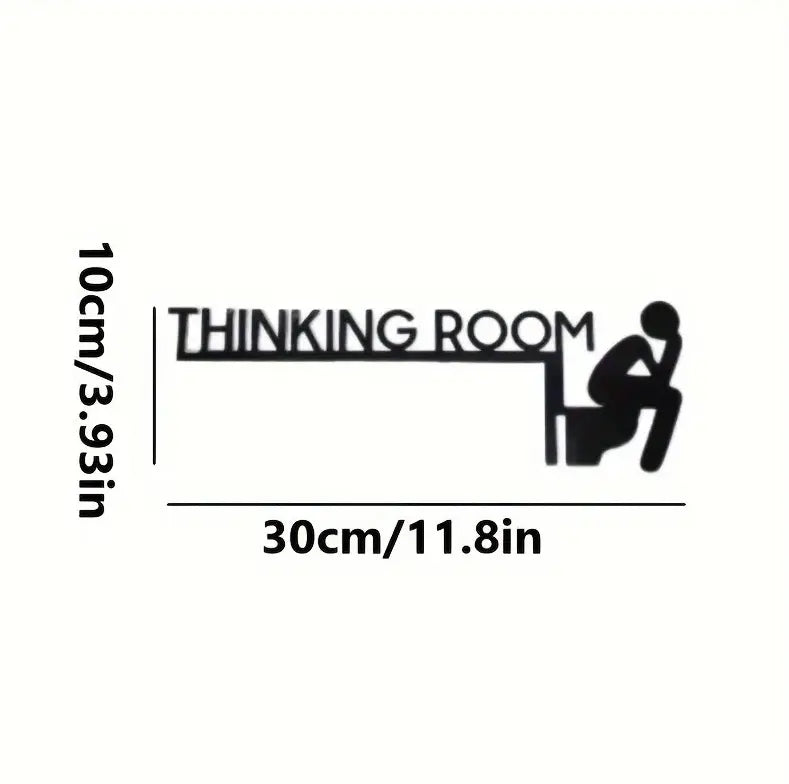 Schwarze Wandkunst aus Metall für ein Denkzimmer mit einer stilisierten Silhouette einer Person, die an einem Schreibtisch sitzt, gestaltet als moderne Toilettenschild-Wanddeko.