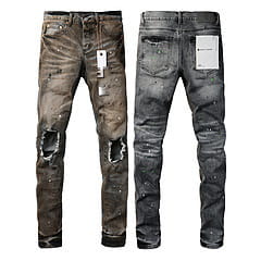 Men’s distressed slim fit patchwork denim jeans in black and gray with ripped knees and faded wash made of denim material.