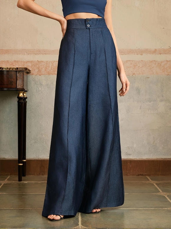High waisted wide leg trousers in navy blue linen with a button closure and pleated front.