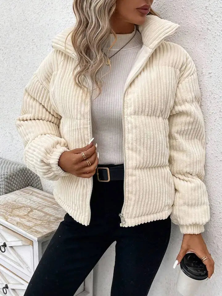 Cream-colored corduroy puffer jacket plus size women winter coat with quilted design and high collar.