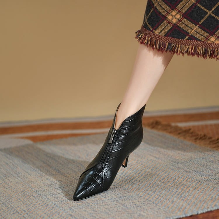 Black crocodile-embossed leather ankle boot with pointed toe and slender stiletto heel.