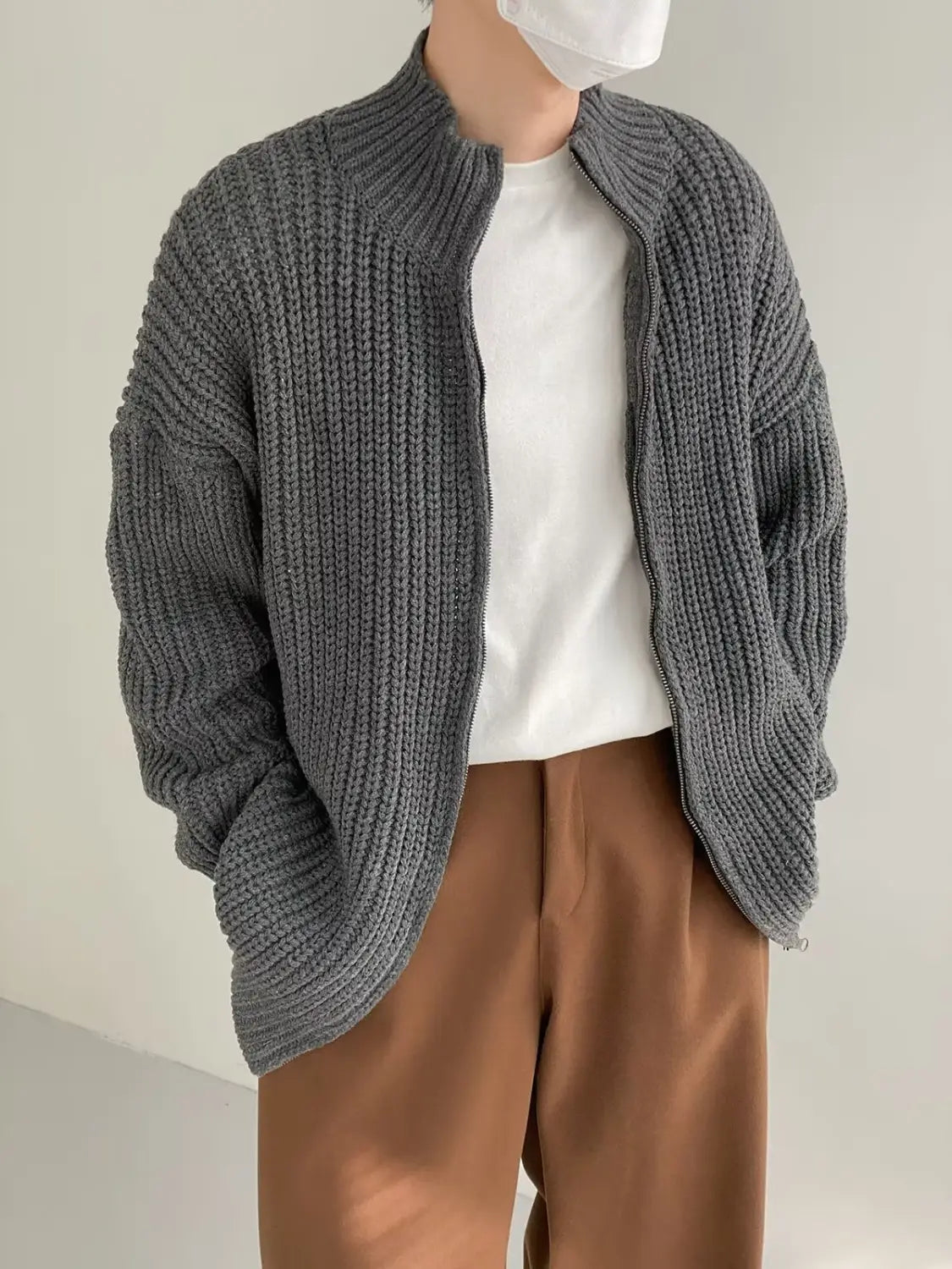 Men’s ribbed knit zip up sweater cardigan in gray featuring a relaxed fit and front zipper closure.