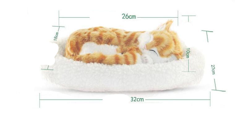 a plush orange and white tabby cat realistic breathing figurine nestled inside a soft fluffy white cushioned pet bed