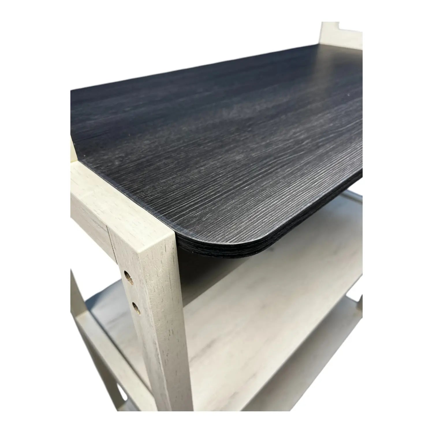 black wood-grain tabletop with light-colored wooden frame on a 5-tier kitchen bakers rack microwave stand in white and black