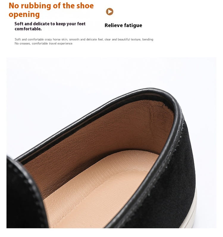 men’s black suede slip on loafers with tan leather lining and white rubber sole displayed from the side.
