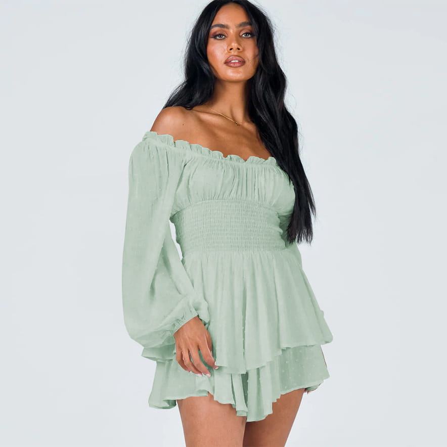 A soft mint green off shoulder long sleeve mini dress with ruffled sleeves and a tiered skirt.