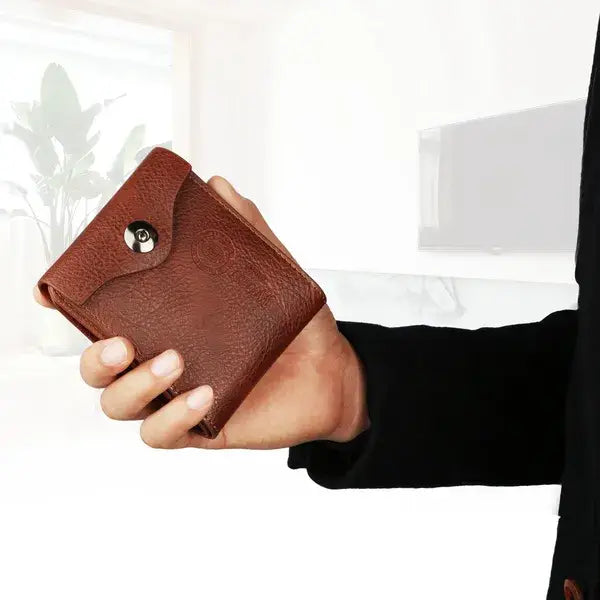 Brown pu leather bifold men’s wallet with rfid blocking feature and silver snap button closure.