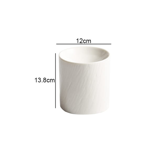 White ceramic cylindrical vase with subtle textured surface featured in a ceramic appetizer bowl set with matte textured finish.