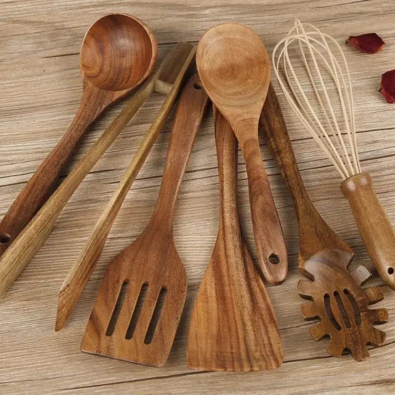 Set of seven wooden cooking utensils with natural wood grain and smooth rounded handles for non stick kitchen use.