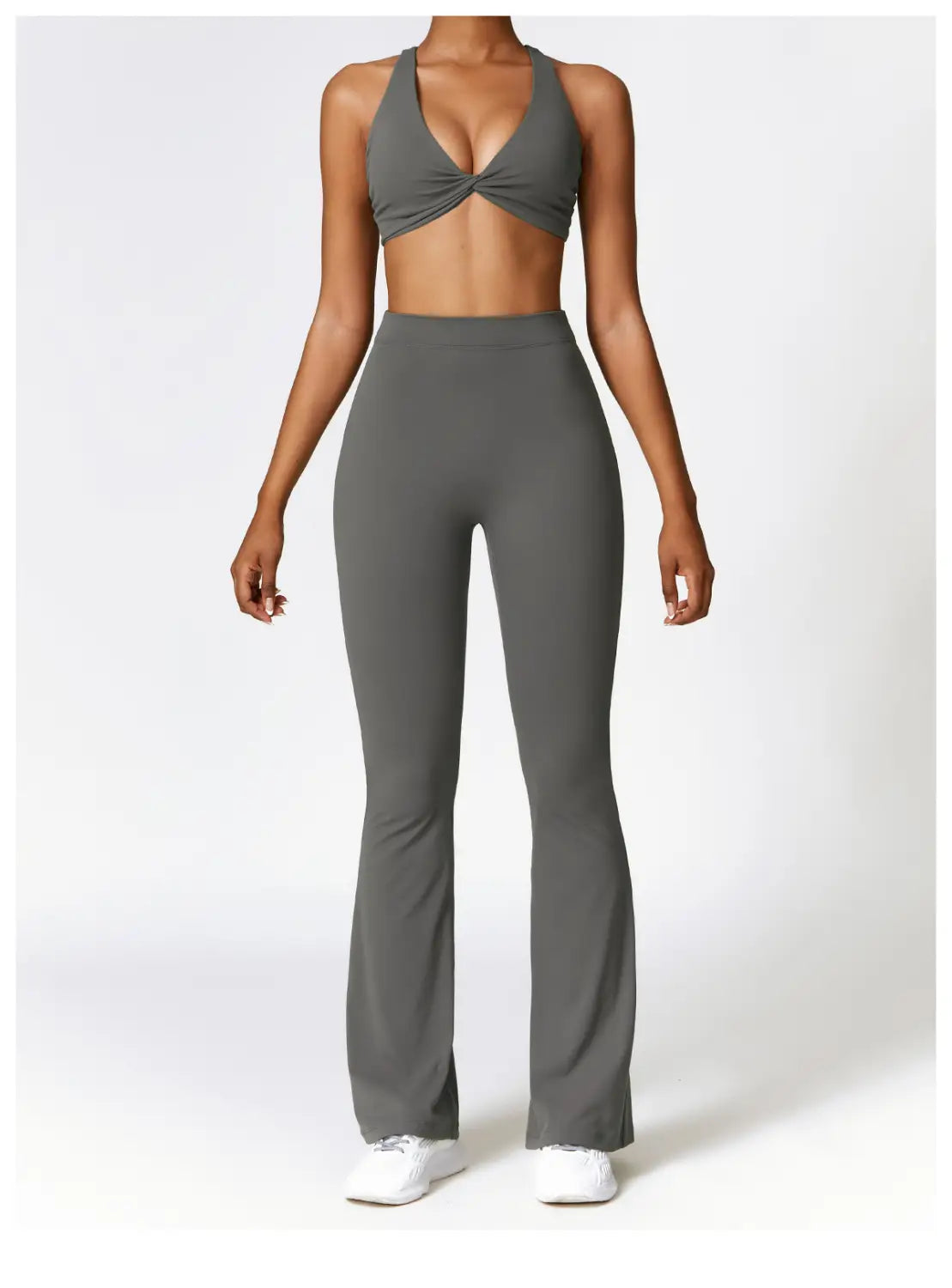 Gray high-waist flared yoga pants made of smooth stretchy fabric designed for active wear.