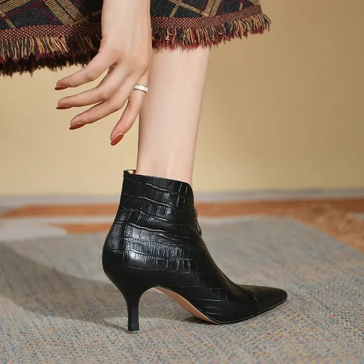 black croc embossed leather stiletto ankle boot with a slender high heel shown from the back side