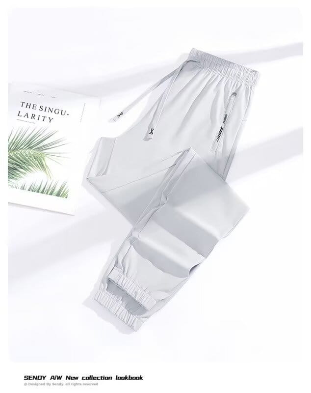 Light gray anti-mosquito casual athletic trousers with elastic waistband drawstrings and subtle black branding on side pockets.
