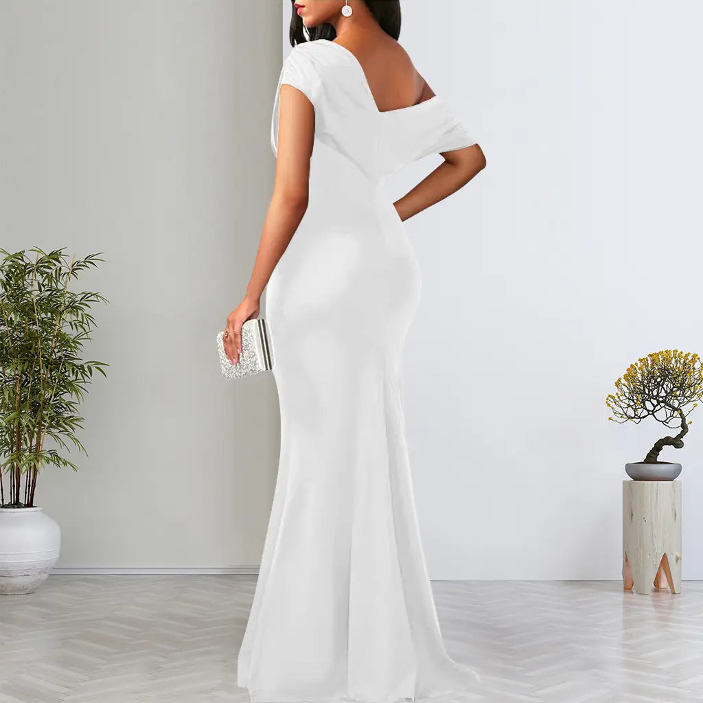 white satin mermaid evening gown with off the shoulder short sleeves and a back cutout shown from the back view