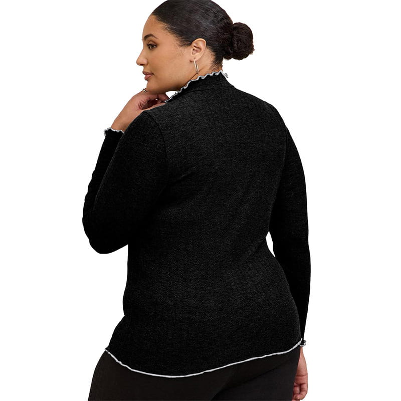Women’s ruffled ribbed knit slim fit mock neck top in black textured fabric with a high collar and white trim along the neckline and hem.
