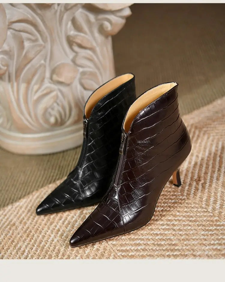 black and dark brown crocodile embossed leather stiletto ankle boots with pointed toes and high heels