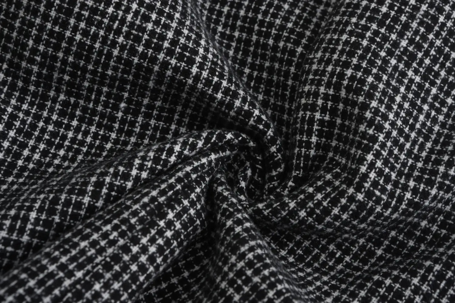 Men’s herringbone double breasted knit blazer featuring black and white houndstooth patterned wool blend fabric with a textured woven appearance.