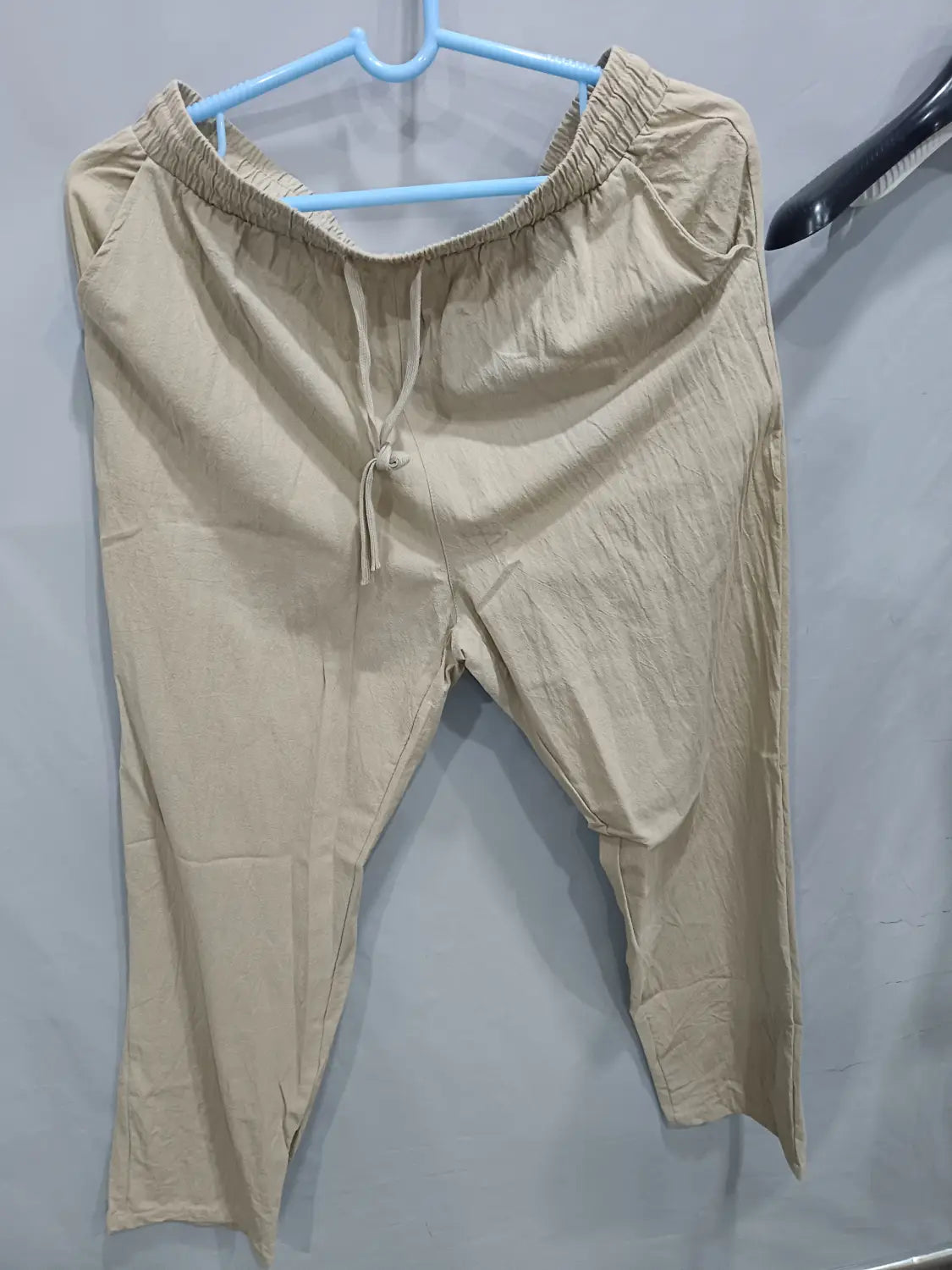 Men’s beige linen joggers casual drawstring pants with an elastic waistband and a relaxed tapered fit
