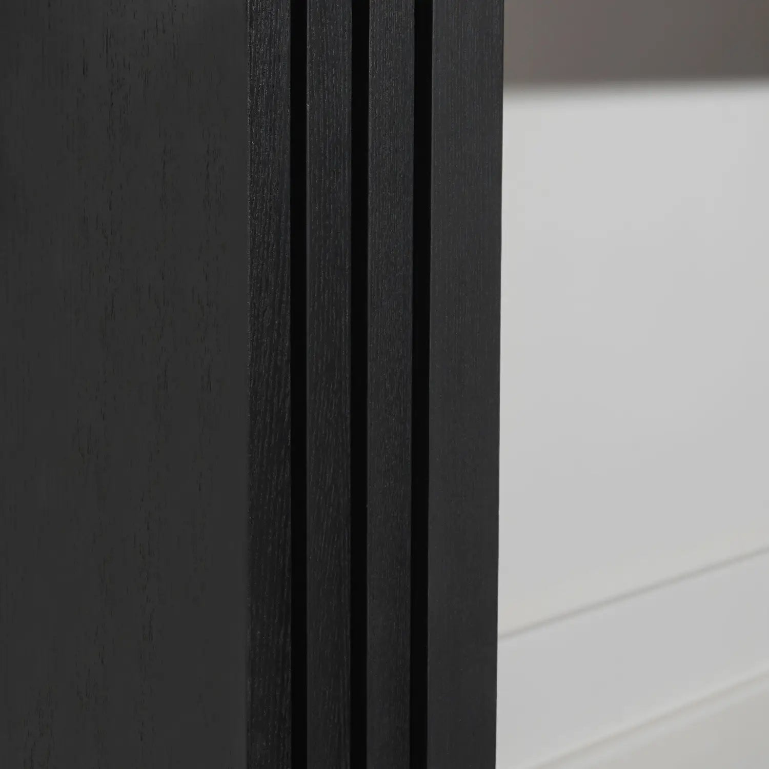 Black wooden console table with vertical grooves and modern design suitable for entryway accent measuring 58 inch.