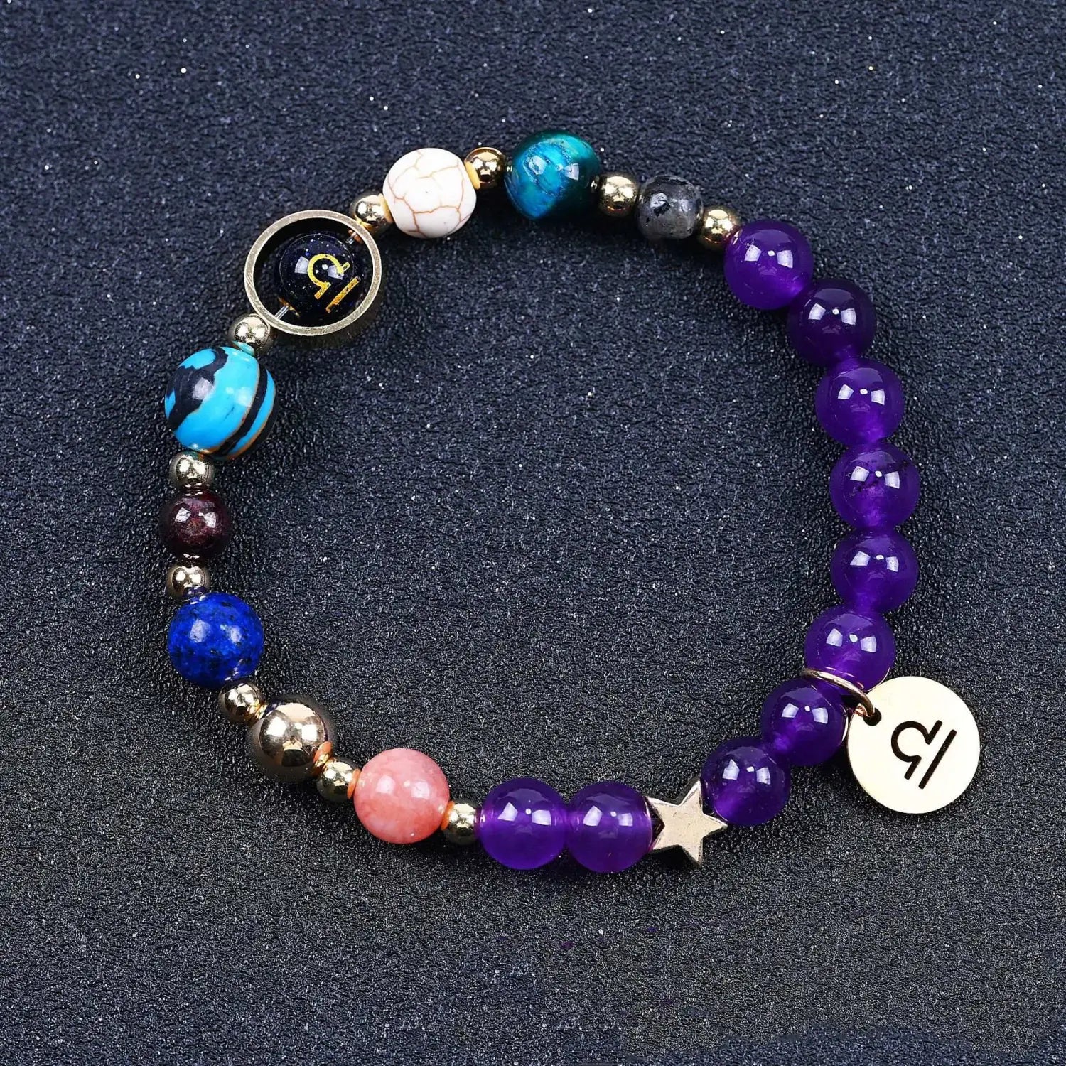 Natural amethyst and agate twelve zodiac beaded bracelet with colorful purple blue and pink stones metallic accents and a star charm.