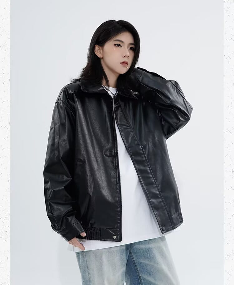Men’s faux leather bomber jacket in black with a matte finish and ribbed cuffs showcasing the relaxed fit outerwear style.